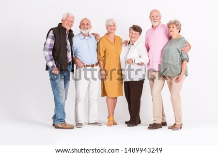 Group of happy senior people standing together