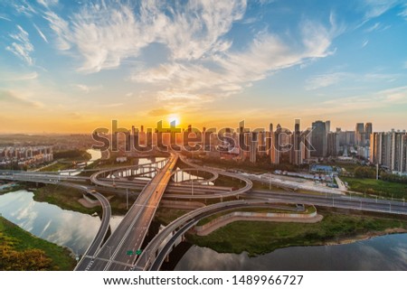 Sunrise of Urban Overpass，skyline and traffic,flyover in modern city.