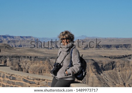 Adult tourists visit Fish river canyon, Namibia