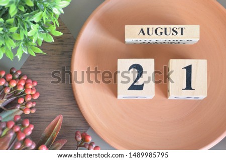 August month design with flower and earthenware, 21.