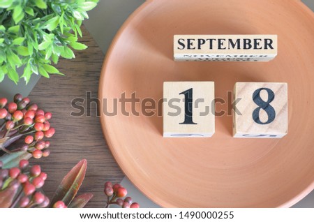 September month design with flower and earthenware, 18.