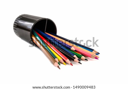 color pencils on a black stand isolated on a white background.