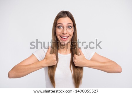 Beautiful lady raising thumbs up approving best quality product wear specs and t-shirt isolated white background