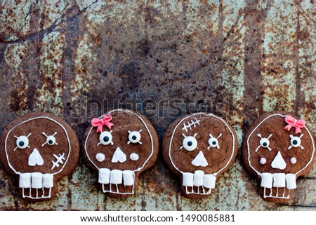 Skull chocolate cookies - traditional treat for children for Halloween or Day of the Dead