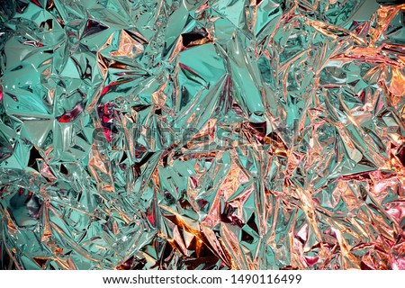 abstract blur background. texture. The background is like crumpled foil. gasoline colors. geometry. unusual colors. struggle of heat and cold. fire and water 