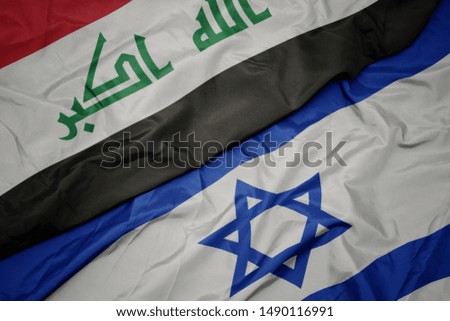 waving colorful flag of israel and national flag of iraq. macro