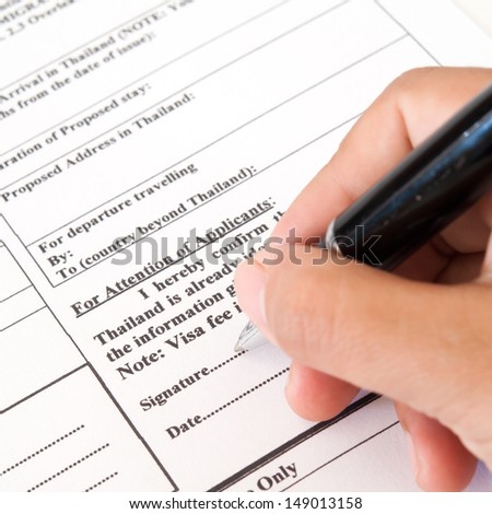 Filling in an application form for visa entry