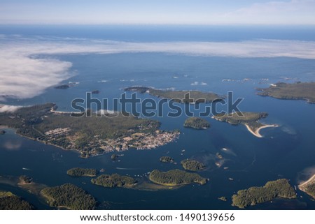 Aerial Landscape View of a touristic town, Tofino, on the Pacific Ocean Coast during a sunny summer morning. Taken in Vancouver Island, British Columbia, Canada.