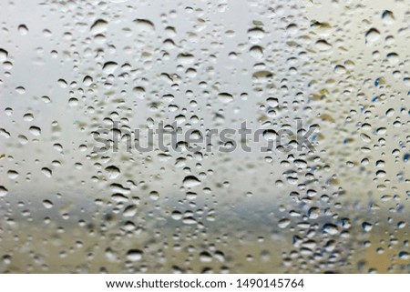 Raindrops on the window, abstract background. Green tone