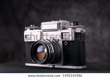 Old vintage film 36mm photo camera, lifestyle memory. Take pictures with a manual lens history.