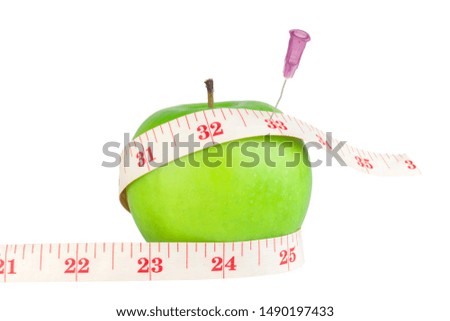 apple green  measuring tape  injection needle isolated on white background.