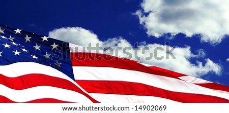 american flag waving against deep blue clouds background