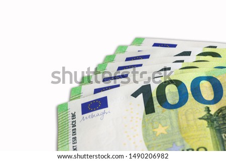 100 Euro banknotes, fanned on white background