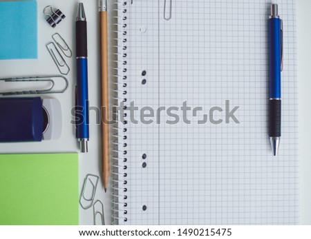 Flat bird view at office table with material structure pen and notes ready to work