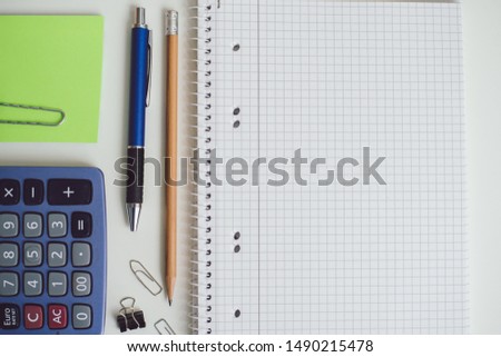 Flat bird view at office table with material structure pen and notes ready to work