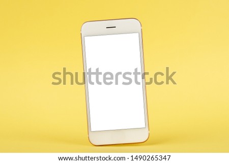Mobile phone mock up on yellow background
