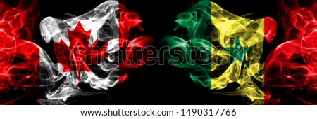 Canada, Canadian, Senegal, Senegalese smoky mystical flags placed side by side. Thick colored silky smokes flag concept