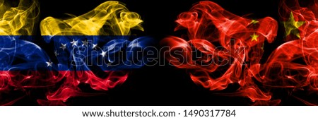Venezuela, Venezuelan, China, Chinese smoky mystical flags placed side by side. Thick colored silky smokes flag concept