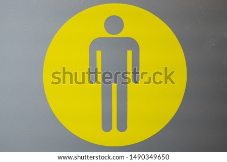 Men toilet sign yellow on grey background