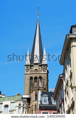 Downtown Aachen with old colorful buildings and the bell tower of Imperial Cathedral in the background. North Rhine-Westphalia, germany.