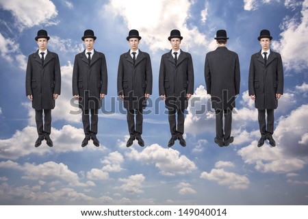 businessmen floating over blue sky with clouds, magritte style Royalty-Free Stock Photo #149040014