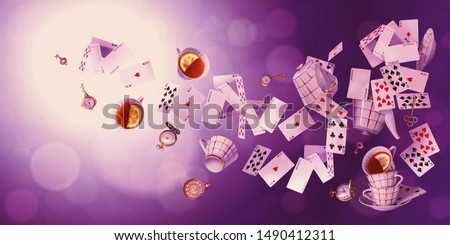 Wonderland background. Mad tea party.Playing cards, pocket watch, key, cup and teapot falling down the rabbit hole. Horizontal banner.