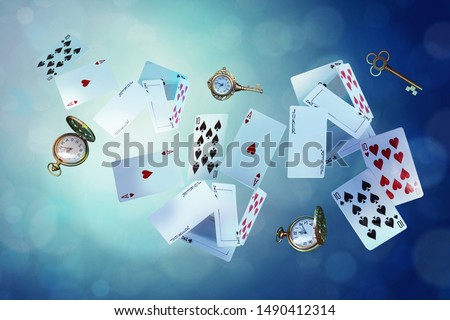 Wonderland background. Playing cards, pocket watch, key,  falling down the rabbit hole. Horizontal banner. Royalty-Free Stock Photo #1490412314