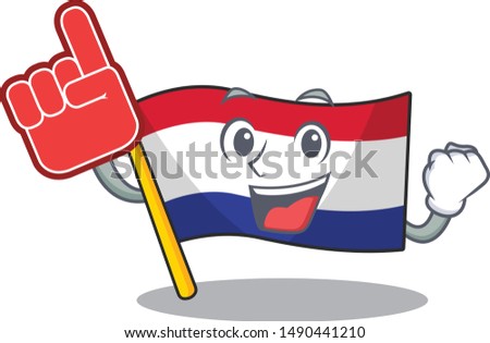 Foam finger netherlands flag above wooden cartoon table