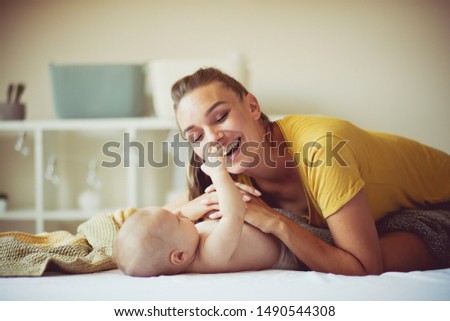  The ultimate gift of love. Mother and her baby boy at home.
