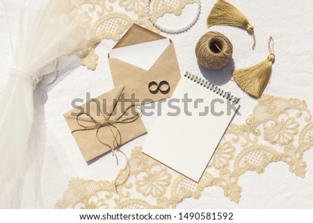 Feminine wedding arrangement with empty notepad