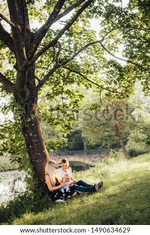 happy young family spending time outdoor on a summer day 