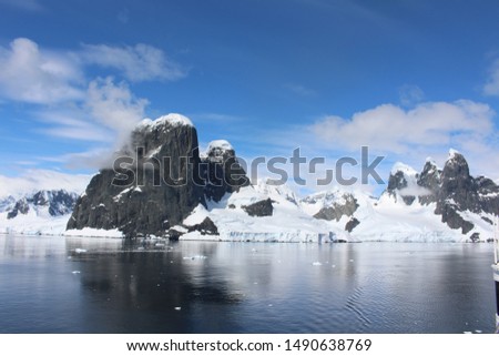 Landscape of snowy mountains of the Lemaire Channel in the Antarctic Peninsula, Antarctica