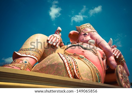 Ganesha idol with blue sky, Thailand.