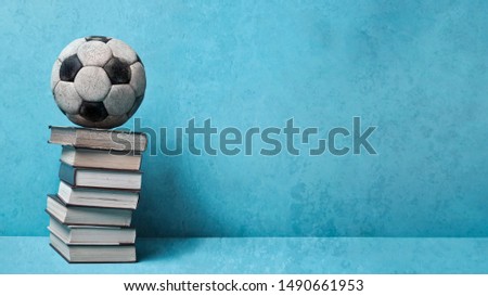 vintage soccer ball on a books