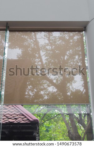 Smooth sheet blinds for protection from the sun, not to heat and shady green trees.