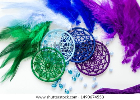 Dream catcher with feathers threads and beads rope hanging. Dreamcatcher handmade on white background