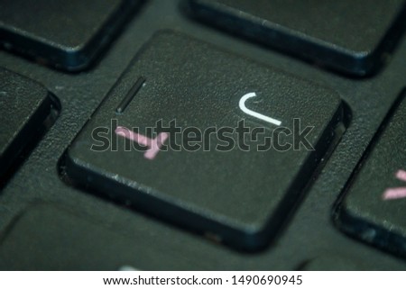 Extreme macro of the letter J on a laptop keyboard