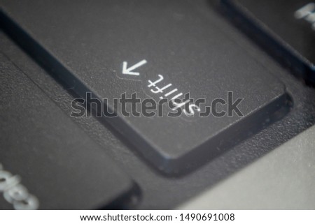Extreme macro of the shift key on a laptop keyboard