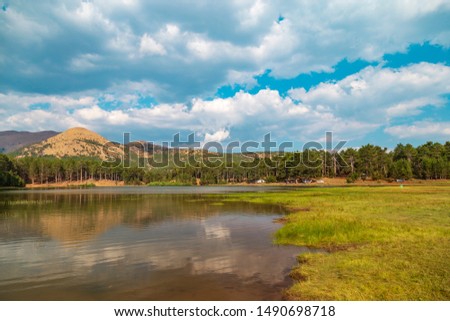 Reflection of mountain on the lake with an amazing forest view. Location: Sandras Mountain, Turkey