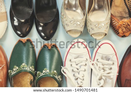 Canva shoe, traditional clog, high heel shoes on top view.