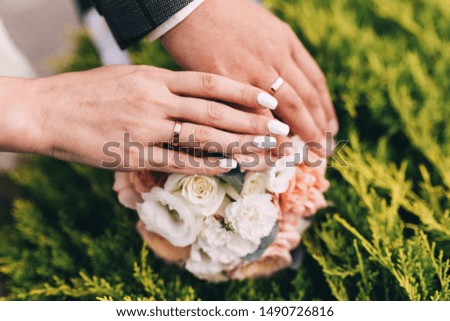 Picture of man and woman with wedding ring. Newly wed couple's hands with wedding rings