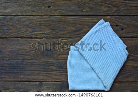 Blue napkin on an wooden table