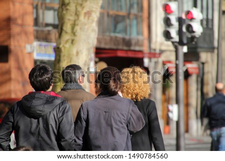 Grouop of people walking in the street