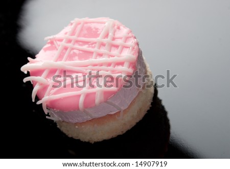 Small cake on black plate