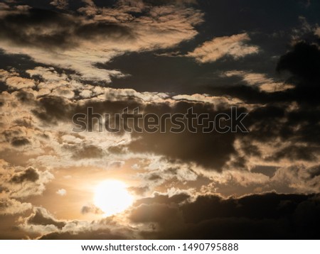 summer cloudscape with clouds, sun and yellow warm color