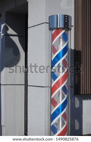 A sign pole in a Japanese barber shop