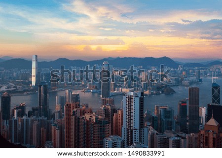 Hong Kong from Victoria Harbor. Business building from viewpoint of the Victoria Peak at dusk. Landscape of Hong Kong city with modern high building in business district area.