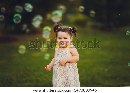 The image of a cute little girl with bubbles.