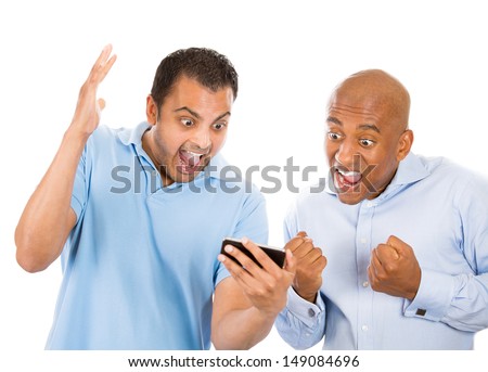 A close-up portrait of two men looking shocked with opened mouth on a cell phone watching a football game or reading an sms, e-mail or viewing latest news, isolated on a white background