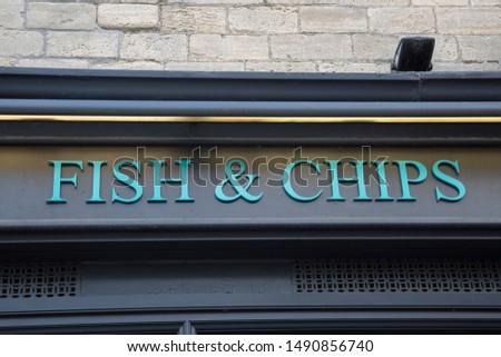 Fish and Chips Sign on Shop Front Royalty-Free Stock Photo #1490856740